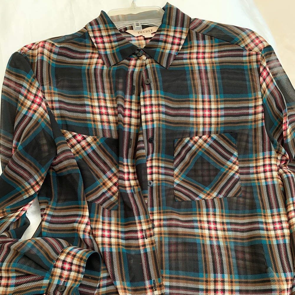 Black long sleeve with multicolored lines.